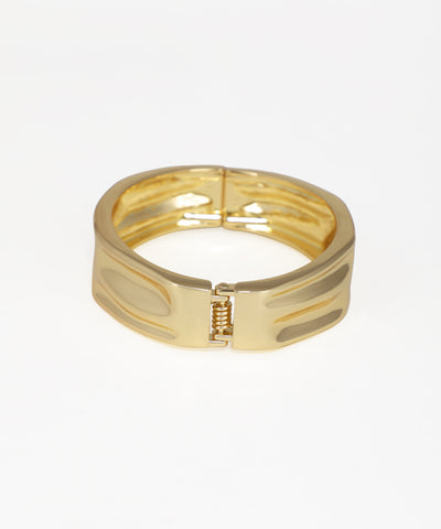 Gold bracelet on a white background