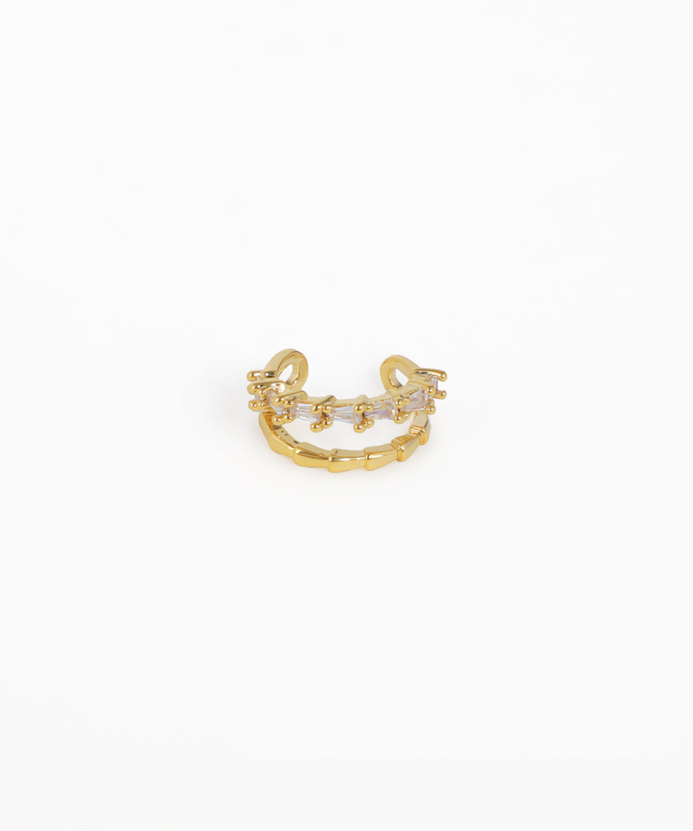 Gold ring with a small diamond on a white background