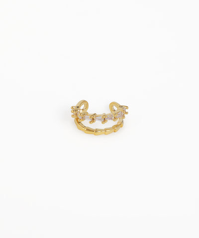 Gold ring with a small diamond on a white background