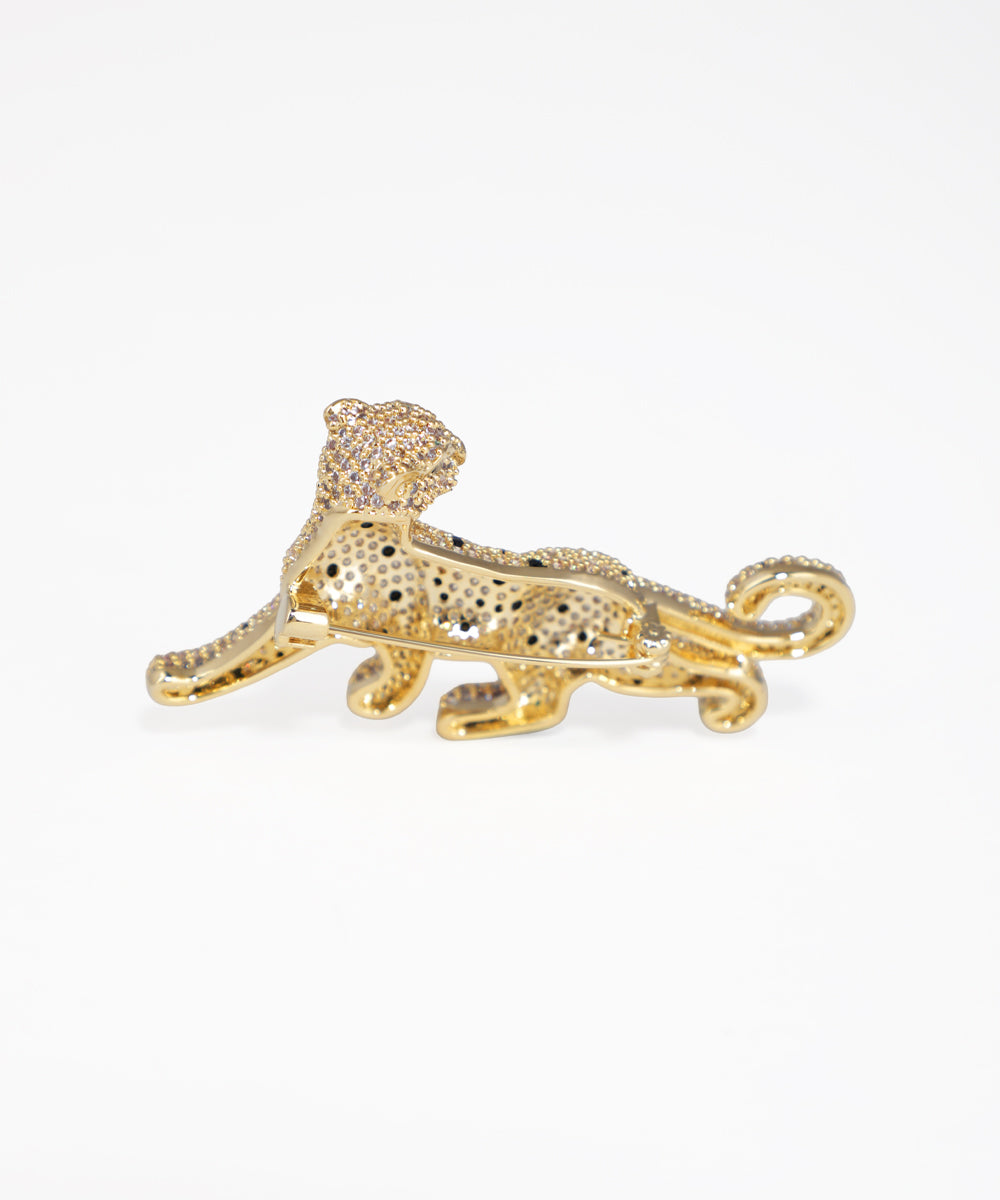 Gold panther brooch on a white background