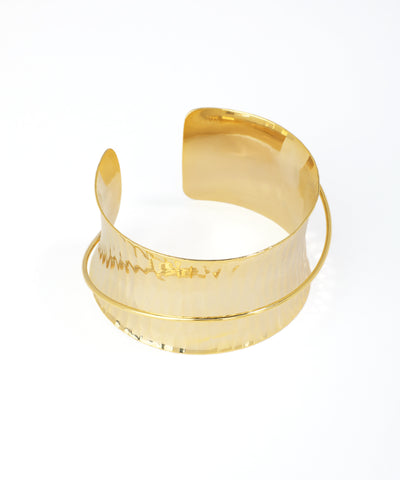 Gold bracelet on a white background