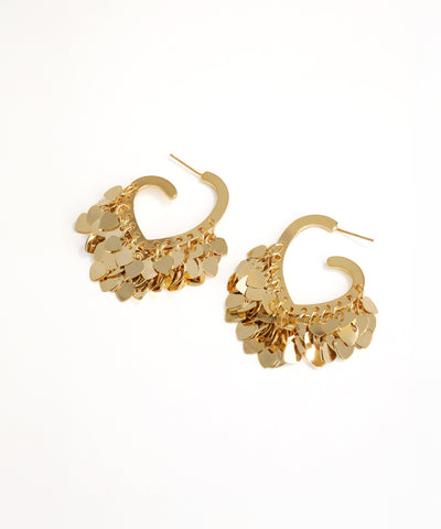 Gold hoop earrings with a textured design on a white background