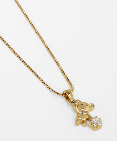 Gold teddy bear pendant necklace on a white background