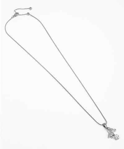 Silver necklace with a small pendant on a white background