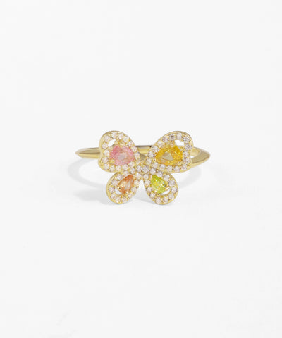 Gold flower-shaped ring with colorful gemstones on a white background