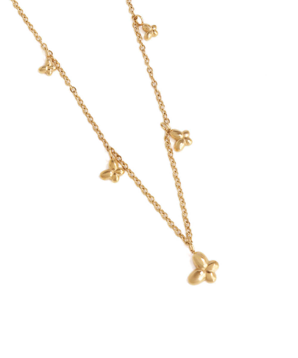 Gold necklace with star-shaped pendants on a white background