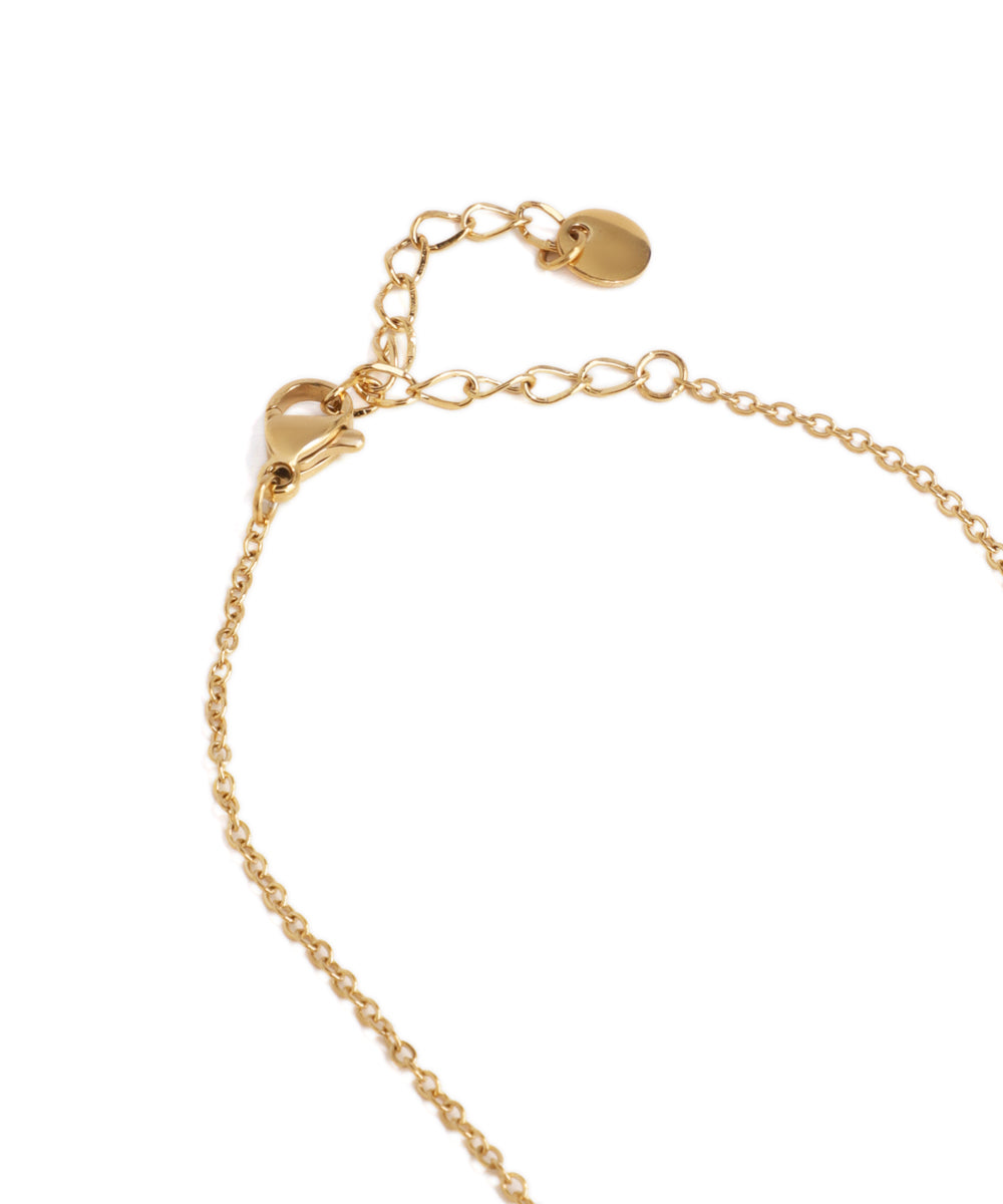 Gold bracelet on a white background