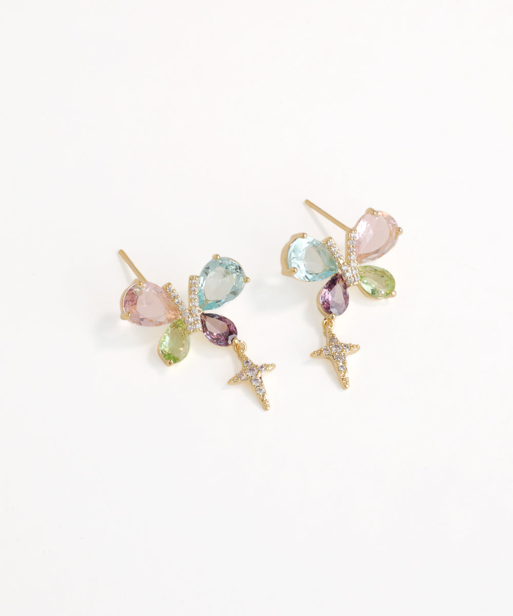 Multicolored gemstone earrings on a white background