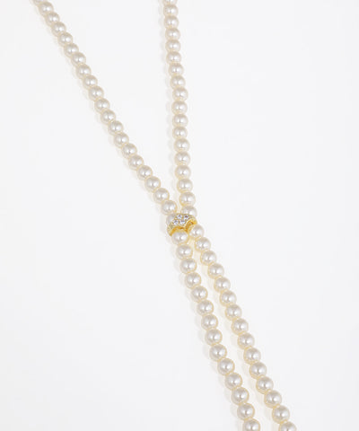 Pearl necklace with a gold clasp on a white background