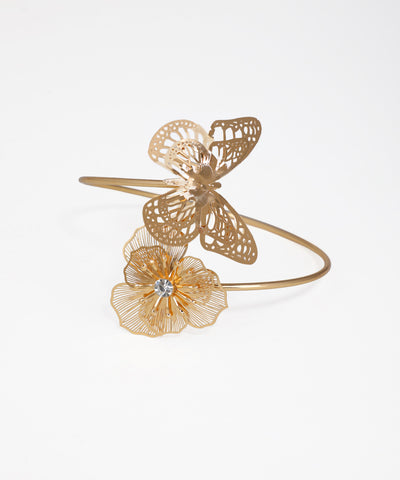 Gold bracelet with butterfly and flower designs on a white background