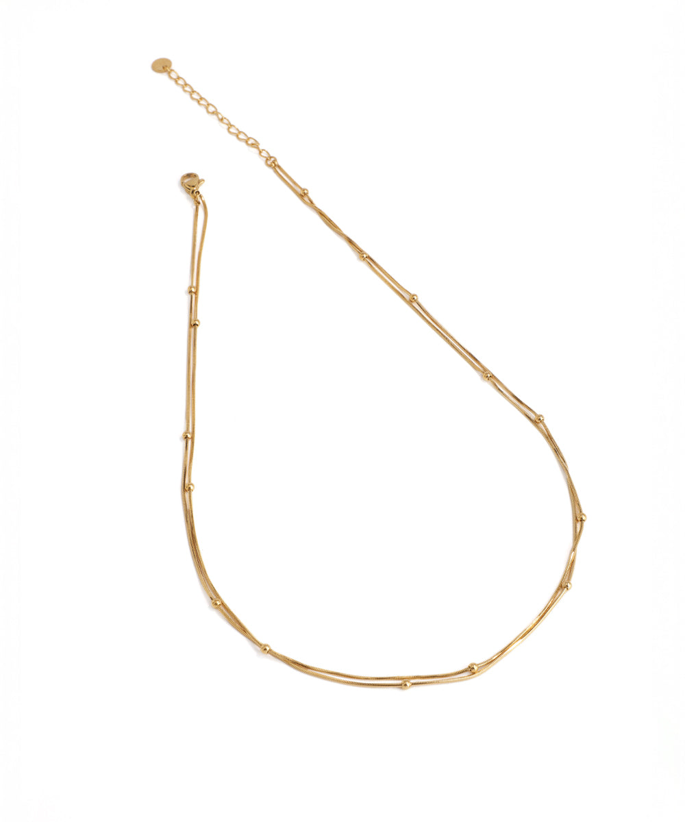 Gold necklace on a white background