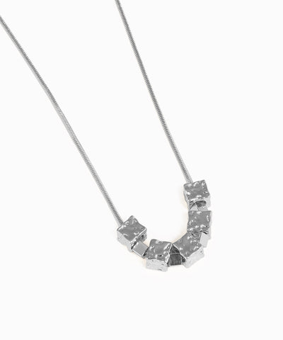 Necklace with a geometric pendant on a white background