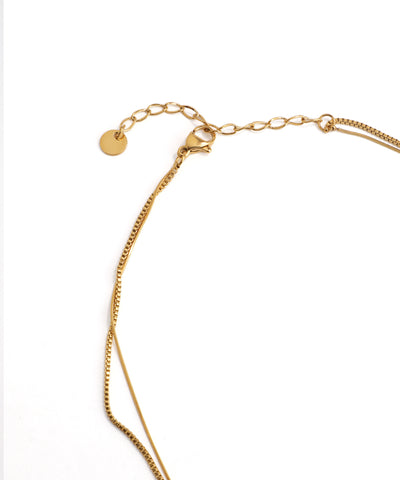 Gold bracelet on a white background