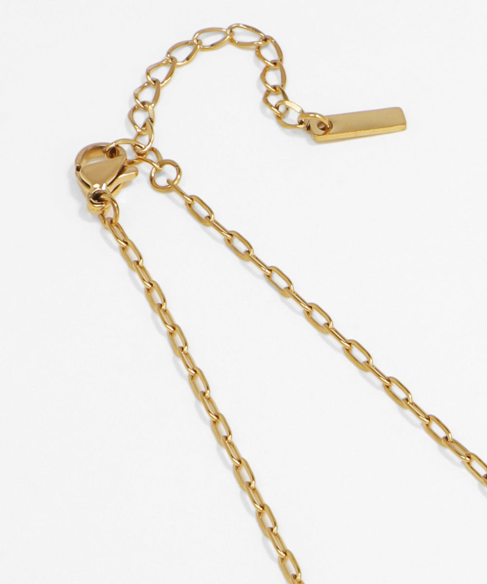 Gold chain bracelet on a white background
