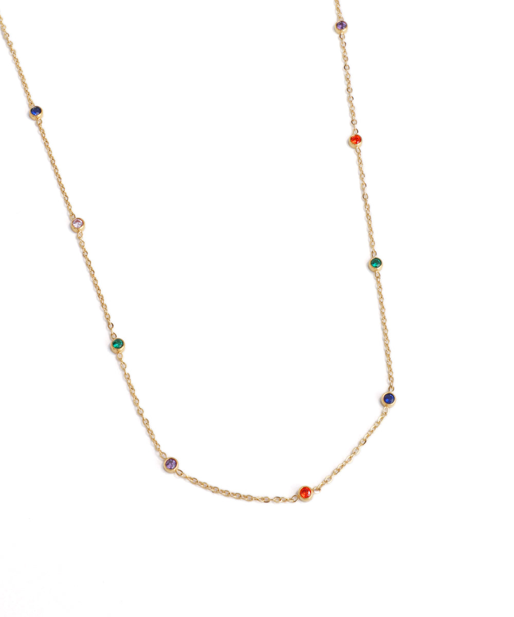 Gold necklace with colorful beads on a white background
