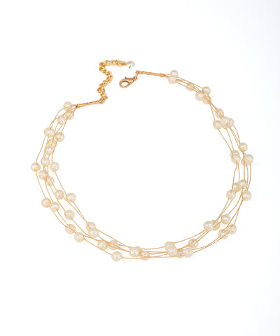 Gold-tone multi-strand necklace with delicate faux pearls and adjustable lobster clasp