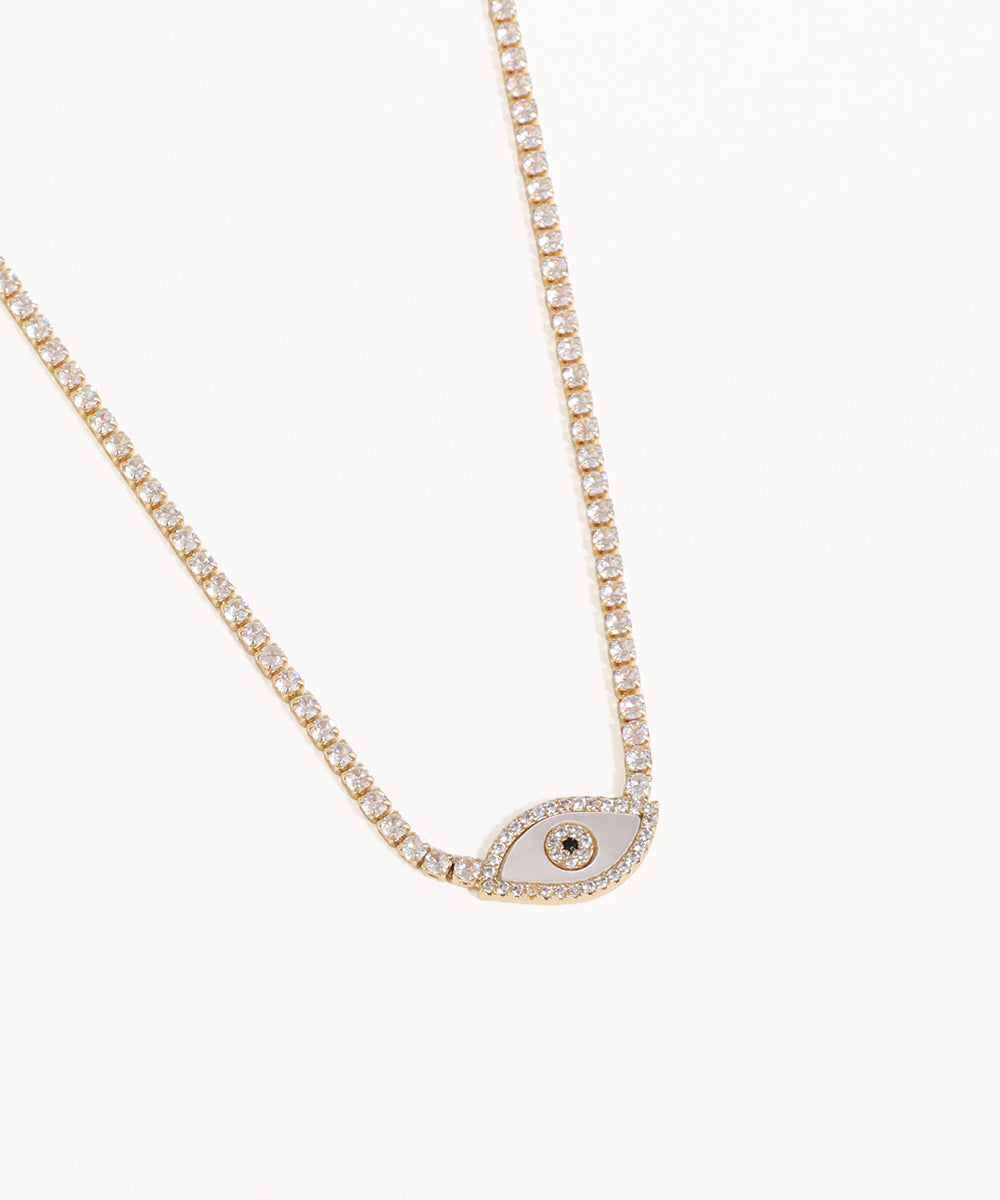 Necklace with a small eye-shaped pendant on a white background