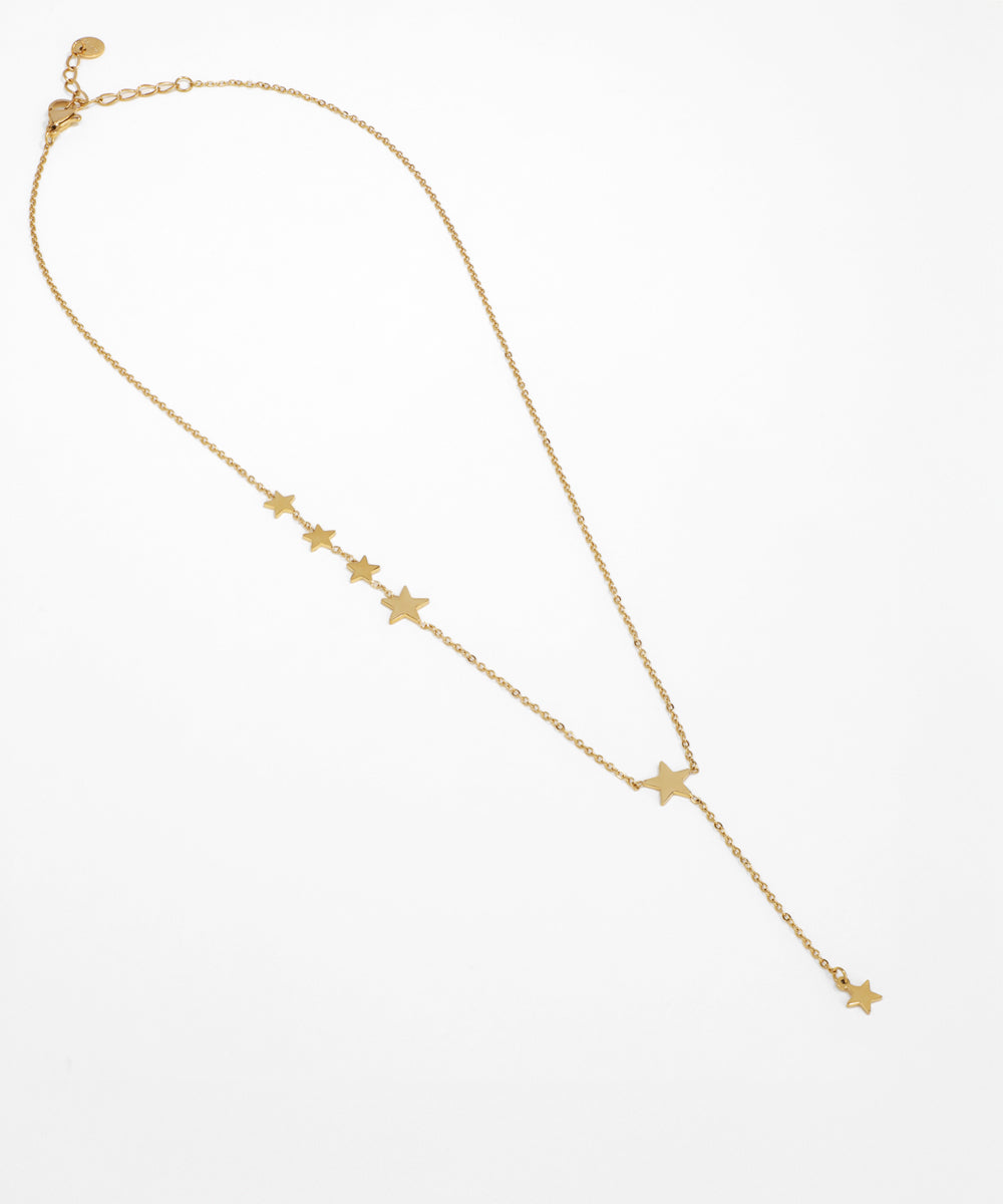 Gold necklace with star-shaped pendants on a white background