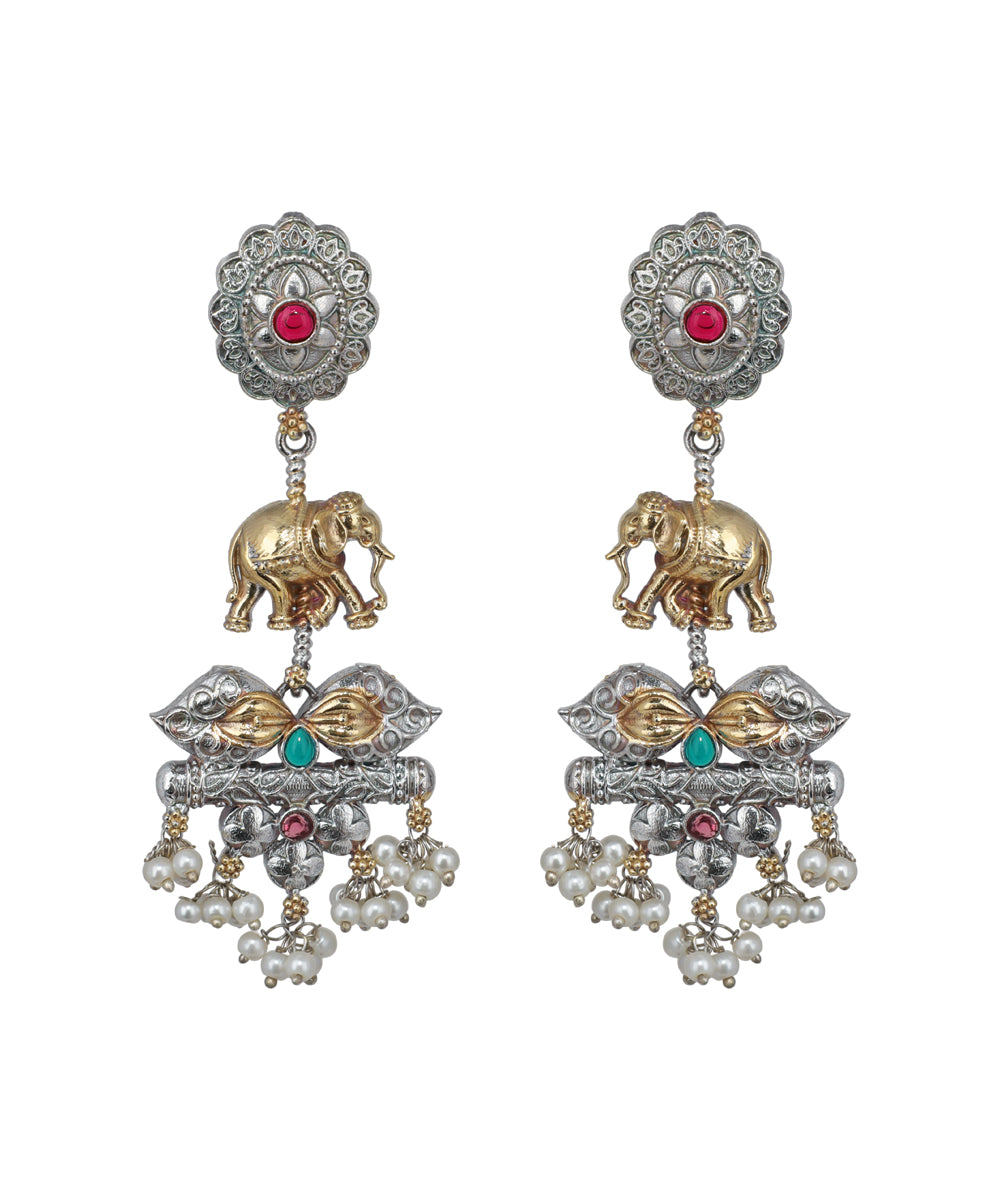 Ornate earrings with elephants, pearls, and gemstones on a white background