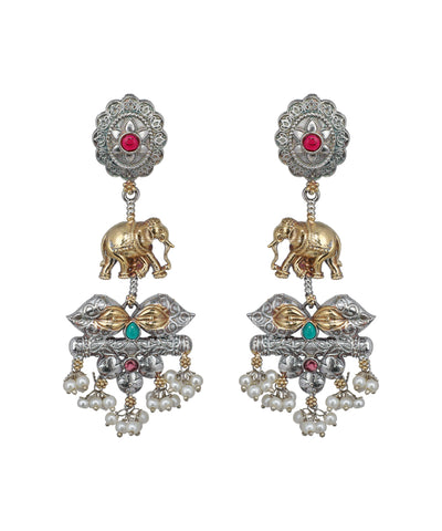 Ornate earrings with elephants, pearls, and gemstones on a white background