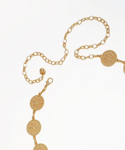 Gold chain belt with circular links on a white background
