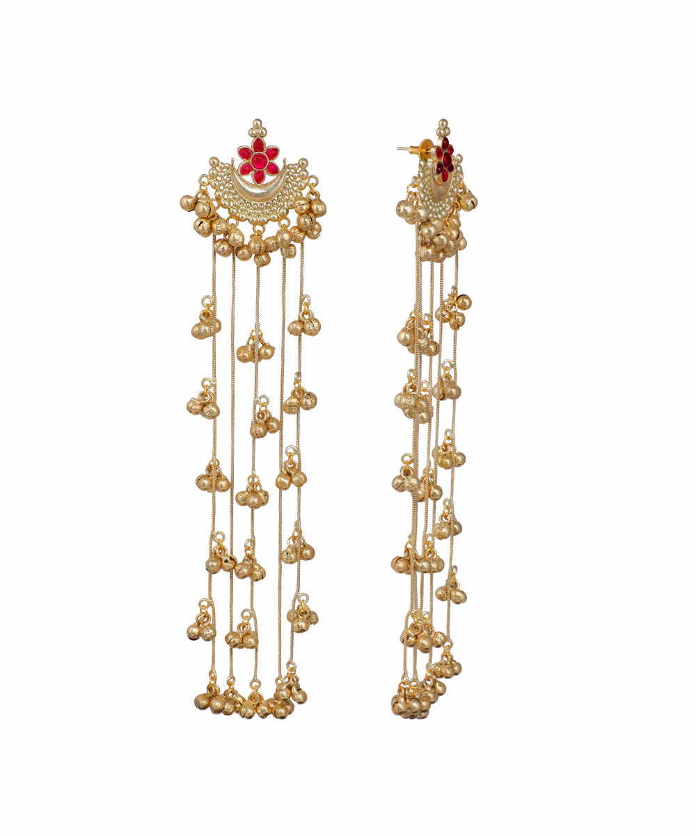 Gold earrings with decorative elements on a white background