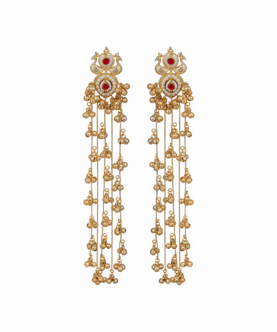 Pair of gold earrings with red gemstones on a white background