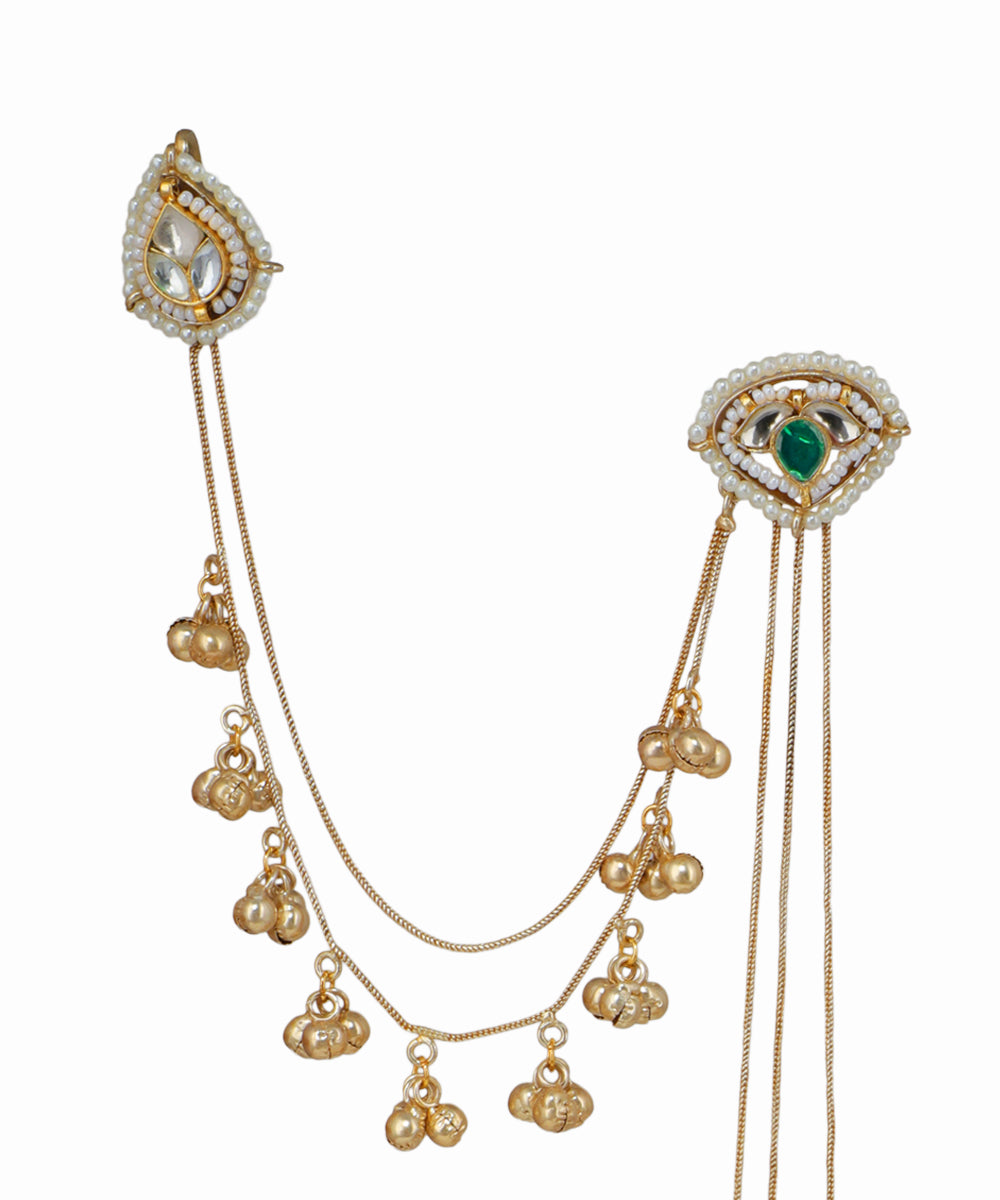 Gold necklace with pendant on a white background