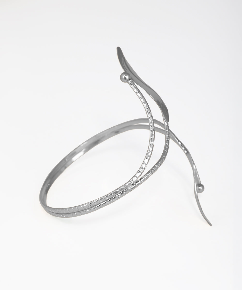 Silver bracelet with a unique design on a white background