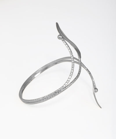 Silver bracelet with a unique design on a white background