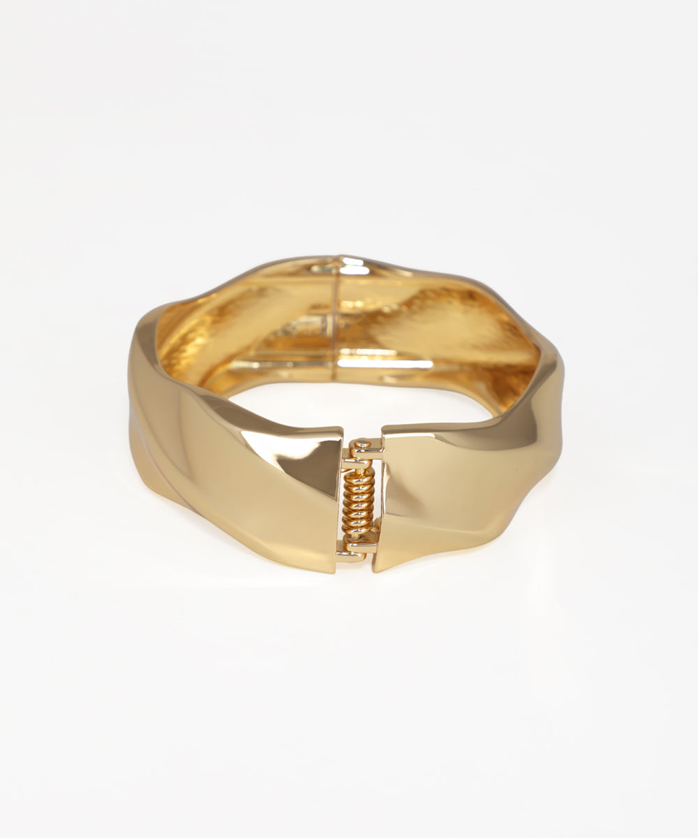Gold bracelet on a white background