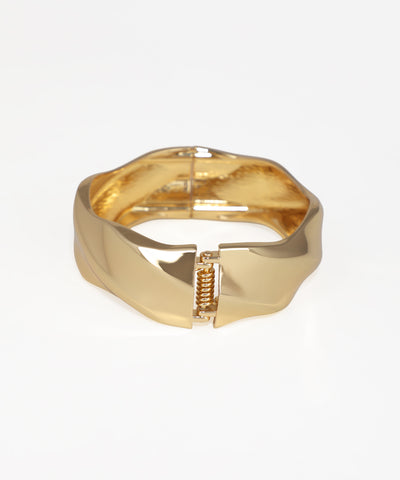 Gold bracelet on a white background