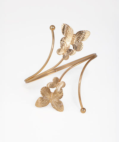 Gold-tone arm cuff with textured butterfly and coiling band design
