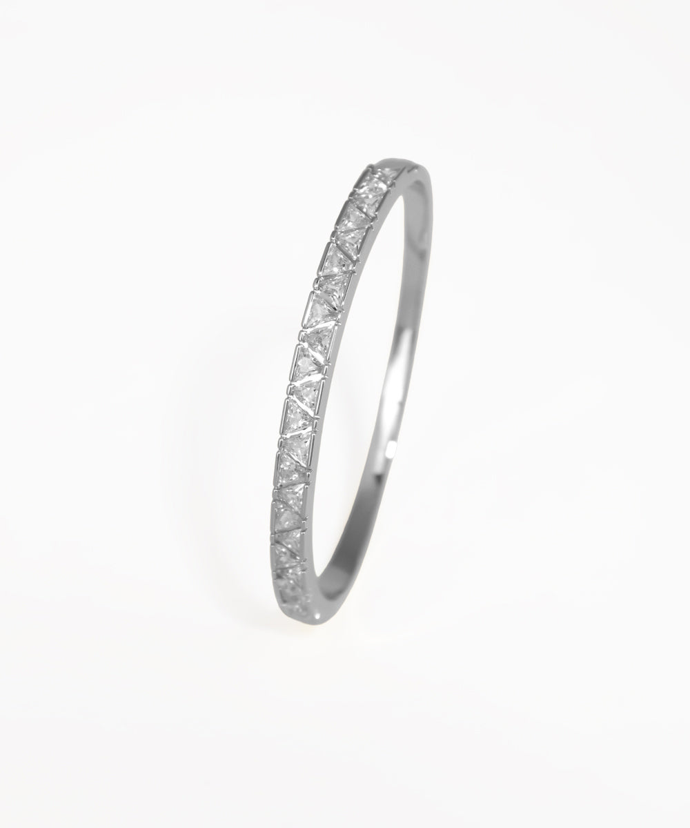 Gold ring with diamond accents on a white background