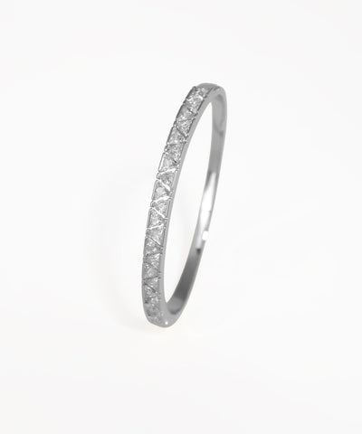 Gold ring with diamond accents on a white background