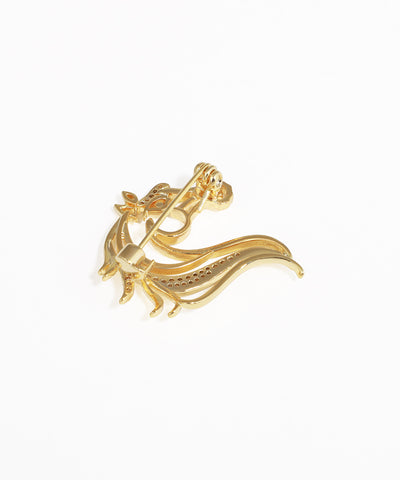 Gold ring with a unique design on a white background