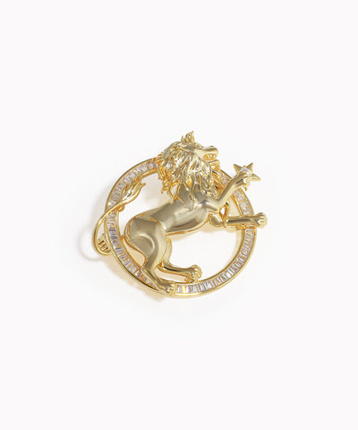 Gold-tone brooch with rearing lion and baguette-cut clear stones in a circular frame