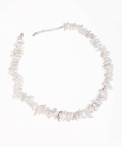 Silver-tone necklace with irregular white chip beads and an extender chain