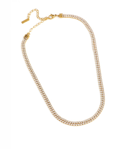 Gold necklace with clear beads on a white background