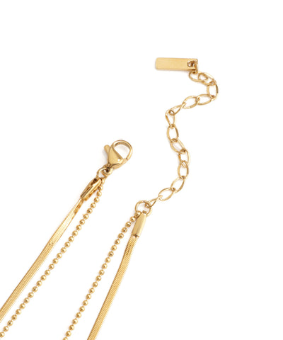 Gold necklace with a clasp on a white background