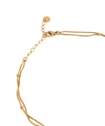 Gold bracelet on a white background