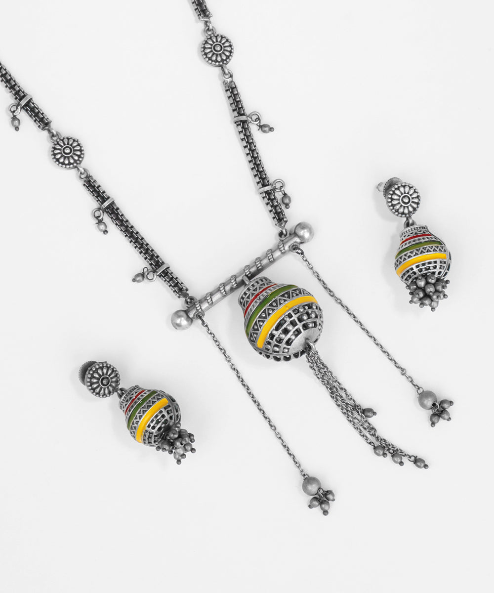 Silver necklace with colorful beads and matching earrings on a white background