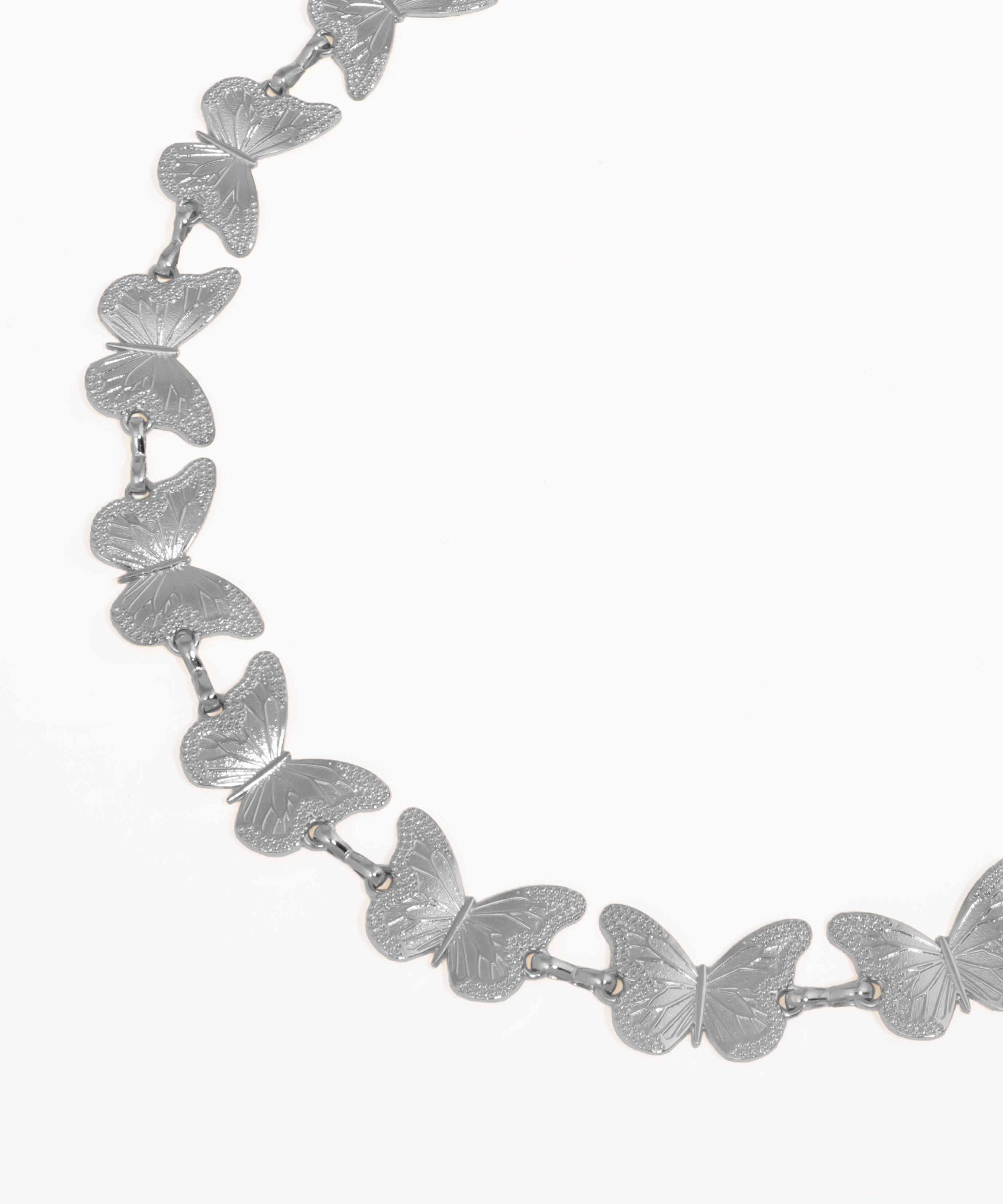 Silver butterfly necklace on a white background
