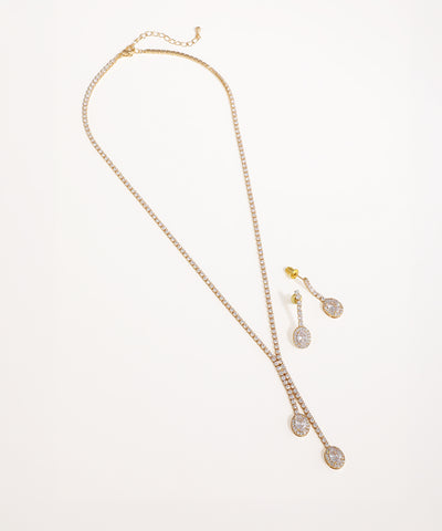 Gold-tone necklace set with brilliant stone Y-drop design and matching oval drop earrings