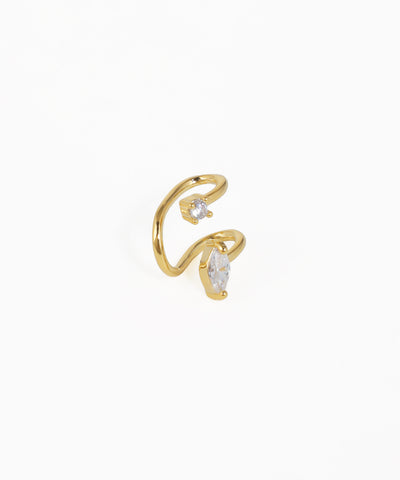 Gold open ring with clear gemstones on a white background