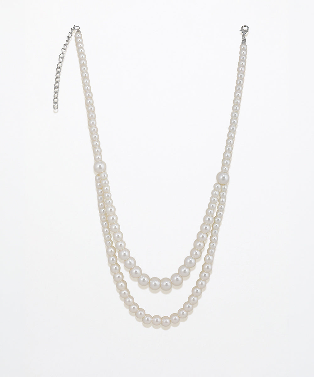 Rhodium finish double layered necklace with varied size faux pearls and extender chain