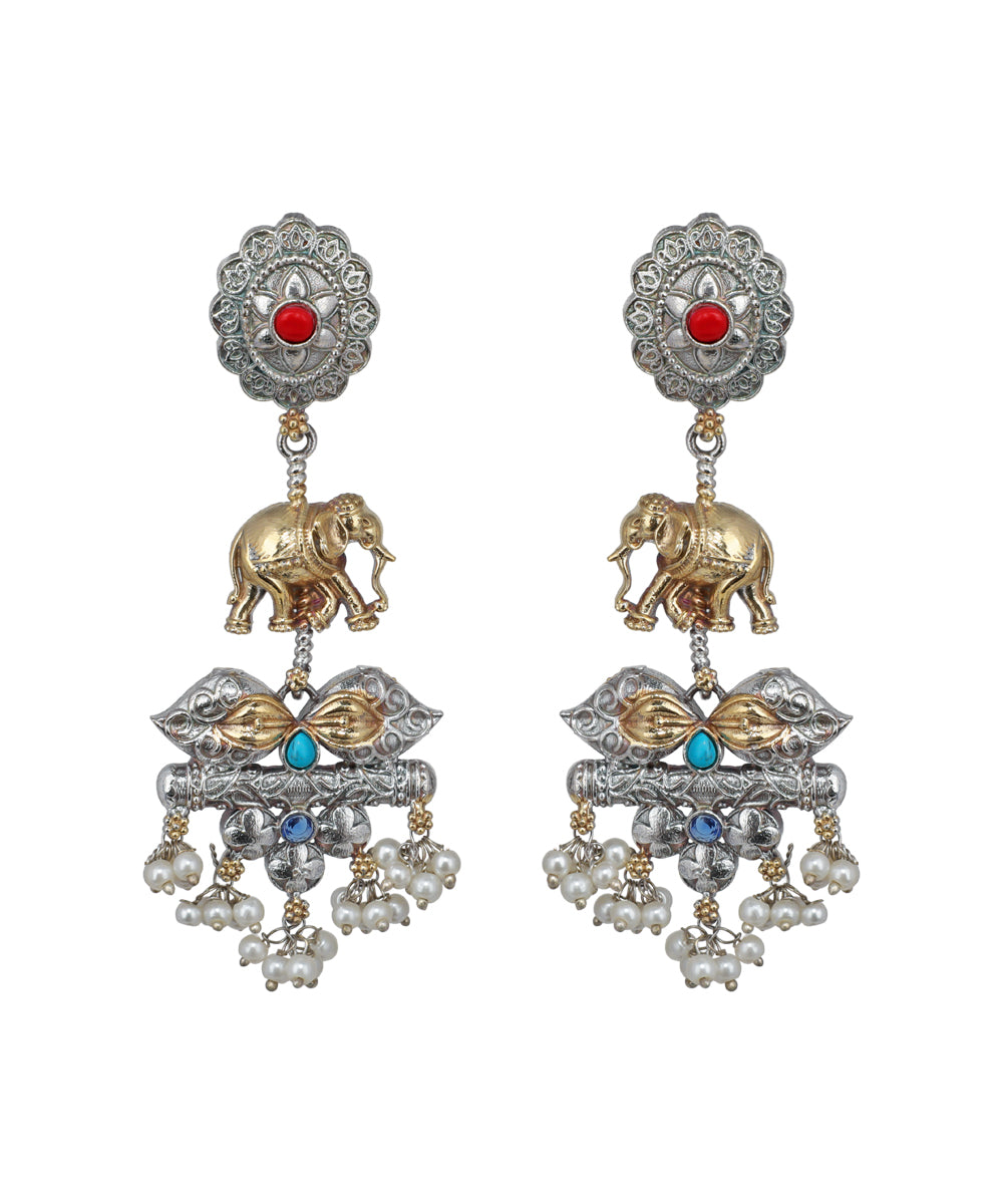 Ornate earrings with elephants, pearls, and gemstones on a white background