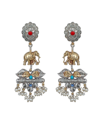 Ornate earrings with elephants, pearls, and gemstones on a white background