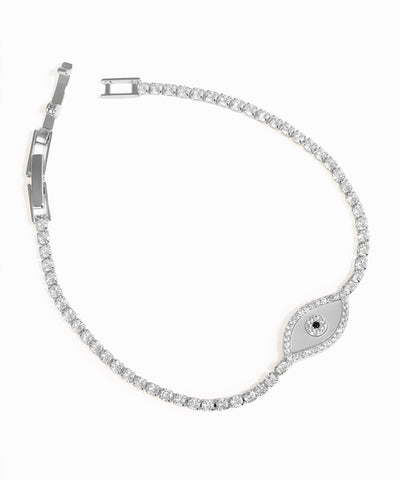 Silver bracelet with diamond accents on a white background