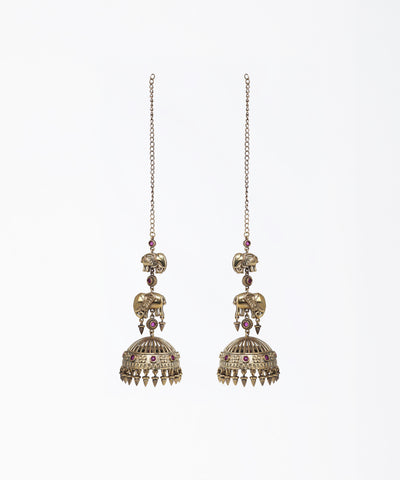 Pair of ornate earrings with intricate designs on a white background